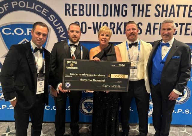 Duty To Act presenting a $35,000 check to C.O.P.S. at National Police Week 2026